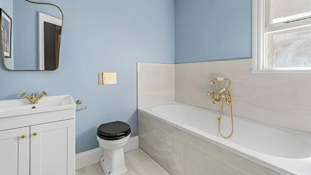 After - The Powder Blue & Gold Guest Bathroom